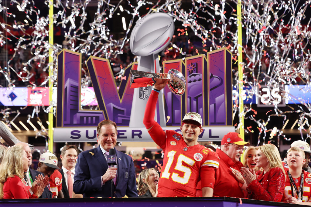 Patrick Mahomes #15 of the Kansas City Chiefs holds the Lombardi Trophy after defeating the San Fra...