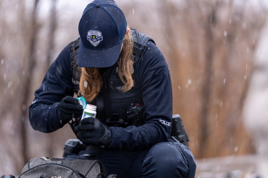 A SLCPD officer, assigned to the Central Patrol Division Bike Squad, conducts a search as part of a...