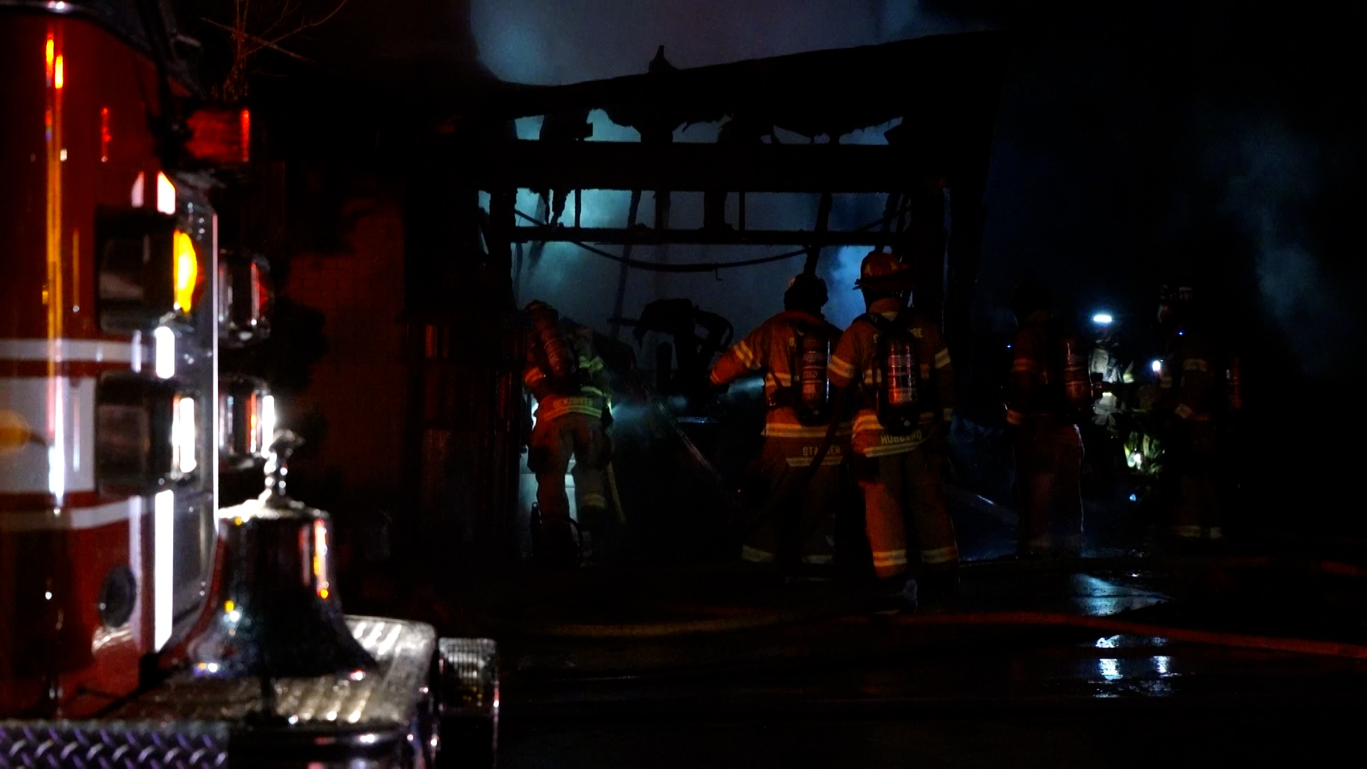 Fire crews at the garage fire attacking potential hot spots. (KSL TV)...