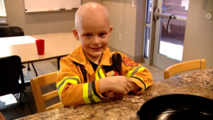Henry at dinner with firefighters.