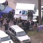 A man in a United States Postal Service truck was detained by police on Monday, Feb. 5, 2024. (Chopper 5, KSL TV)