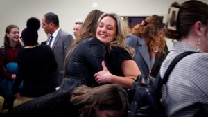 Leah Moses hugs a supporter after a legislative panel advanced a reform bill focused on Utah’s family court system. 