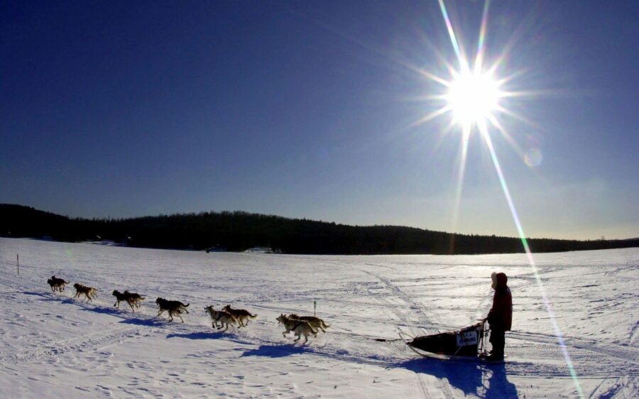 A sled dog team crosses Portage Lake in Portage, Maine, during the Can Am Crown 250 in 2001. (Rober...