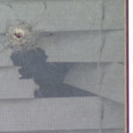 A bullet went through one of the windows in Corina Pierattini's home. (Mike Anderson, KSL TV)