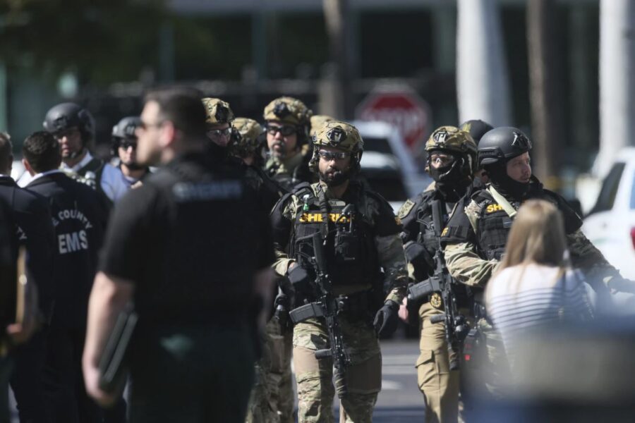 A large number of law enforcement swarmed a hostage situation at the Bank of America building at Be...