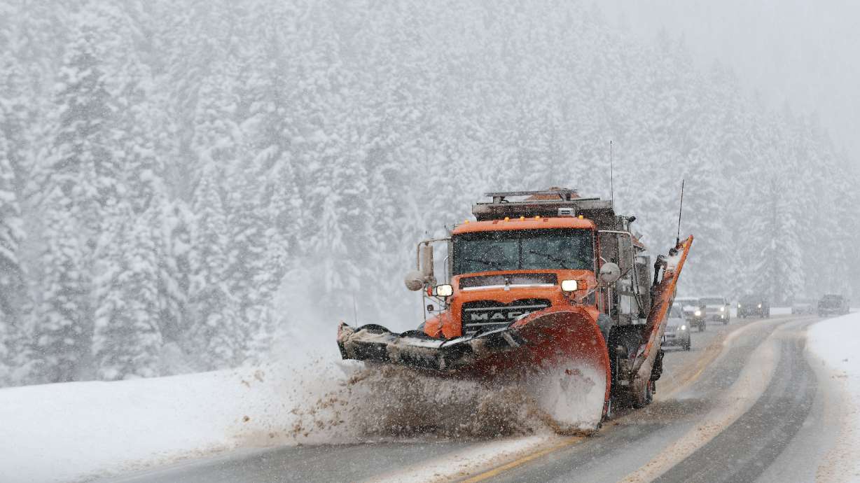 A UDOT snowplow clears the road in Big Cottonwood Canyon on Feb. 9. Up to 2 feet of snow or more is...