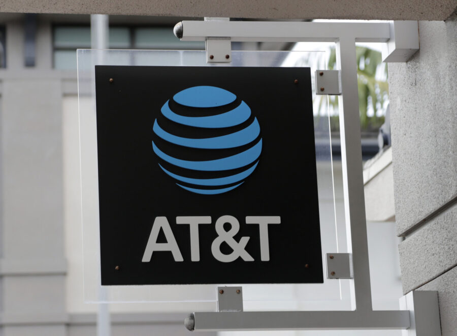 FILE - The sign in front of an AT&T retail store is seen in Miami, July 18, 2019. The theft of ...