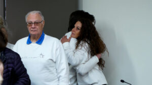 Cami Johnson hugs a family member at a parole board hearing for her ex-husband, Byron Thad Haderlie. (Josh Szymanik, KSL-TV) 
