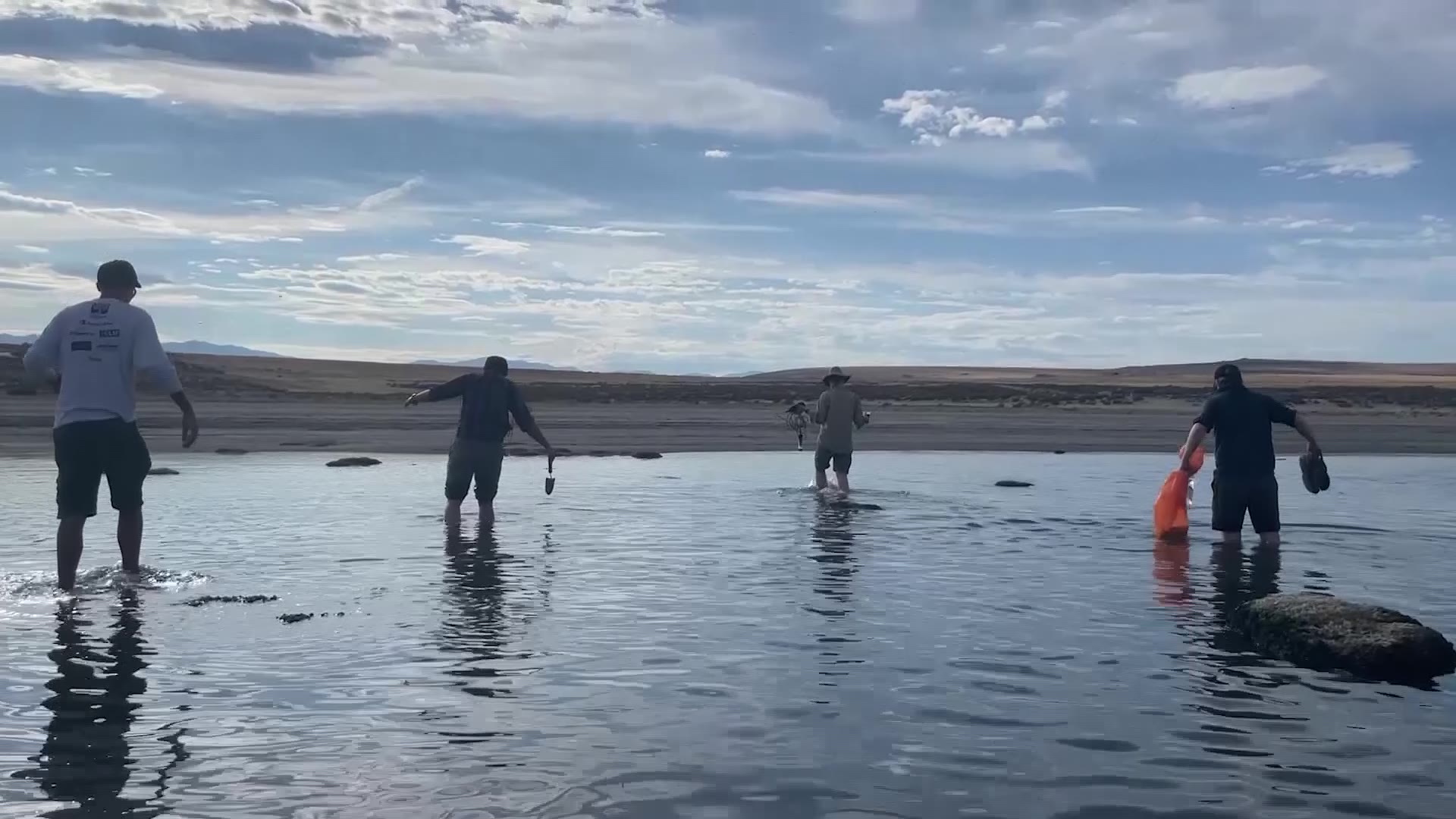 University of Utah researchers searching the sands and waters of the Great Salt lake for samples....