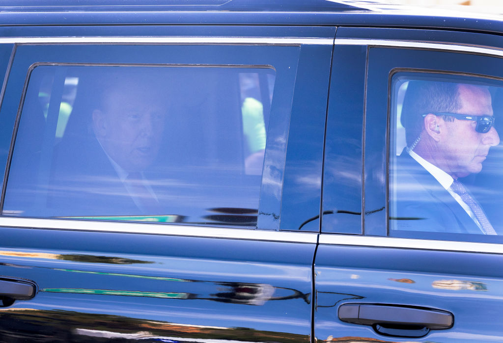 Former U.S. President Donald Trump is driven from the Alto Lee Adams Sr. U.S. Courthouse on March 1...