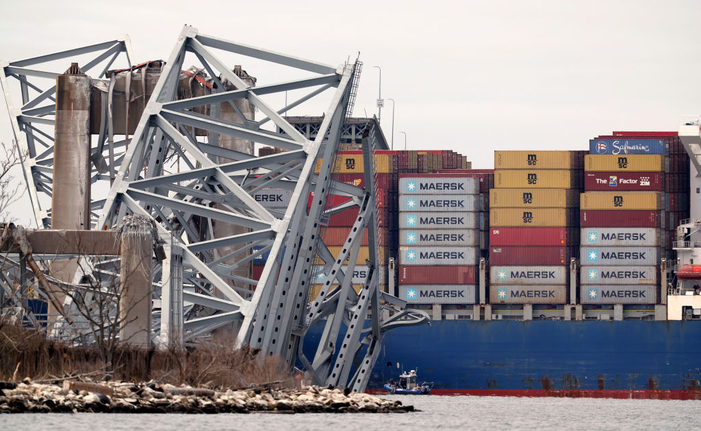 The cargo ship Dali sits in the water after running into and collapsing the Francis Scott Key Bridg...