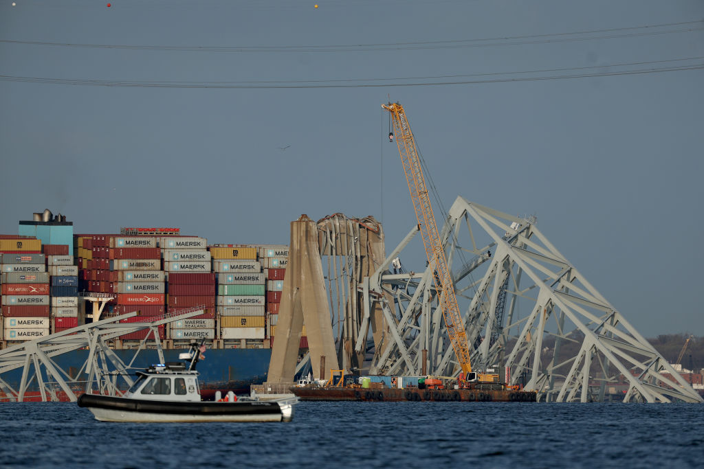 A crane works on the debris of the Francis Scott Key Bridge on March 29, 2024 in Baltimore, Marylan...