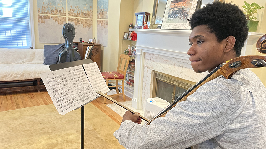 Getro Joseph, a cellist from Haiti who is living in Utah as a student and is a member of the Utah S...