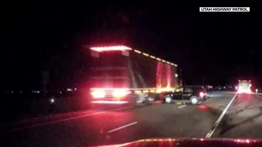 A semi drives past a crash on Interstate 15 in southern Utah last week. Just moments before, people...