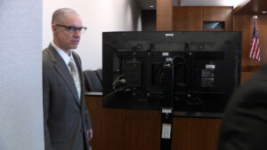 Hoover walking into the courtroom. 