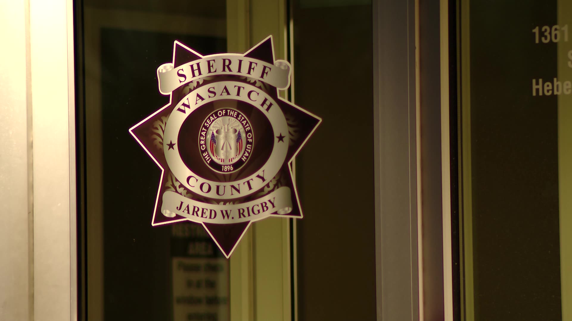 The Wasatch County Sherriff's logo on the doors of the offices in Heber....