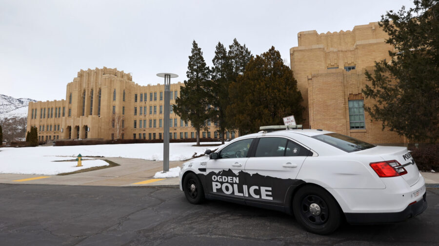 Police maintain a presence after responding to false threats of shots fired at Ogden High School in...