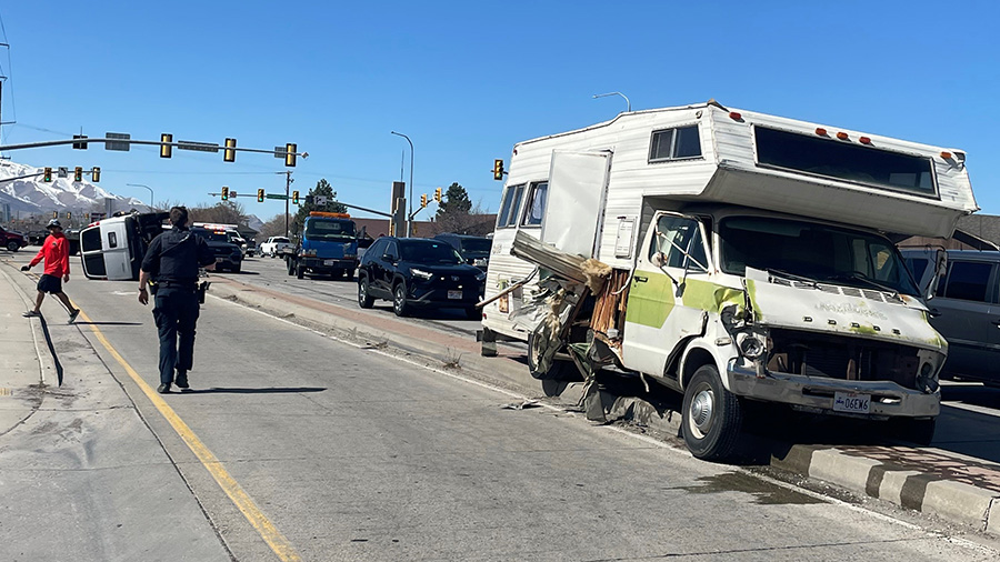 The driver of an RV was arrested after police said he rammed a police vehicle and hit four others o...