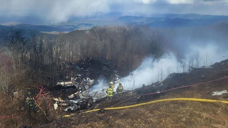 An emergency crew works at the site of a plane crash in Hot Springs, Virginia, on March 10. (Austin...