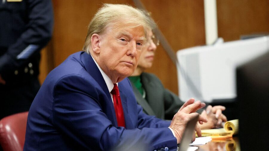 Former U.S. President Donald Trump sits in the courtroom at a hearing in his criminal case on charg...