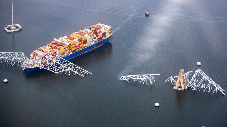 In an aerial view, cargo ship Dali is seen after running into and collapsing the Francis Scott Key ...
