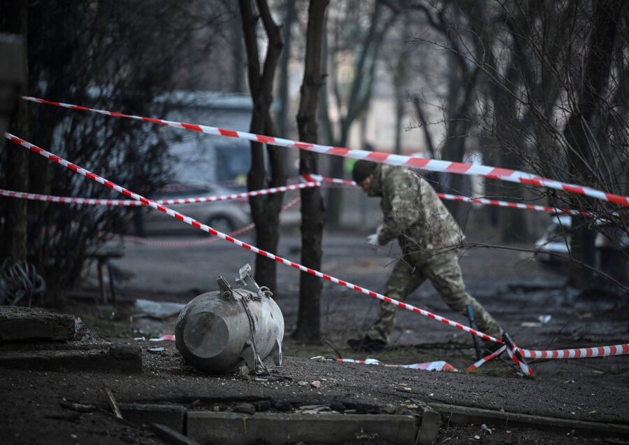 A bomb squad member works next to a part of a missile after a Russian missile attack in Kyiv.
Manda...
