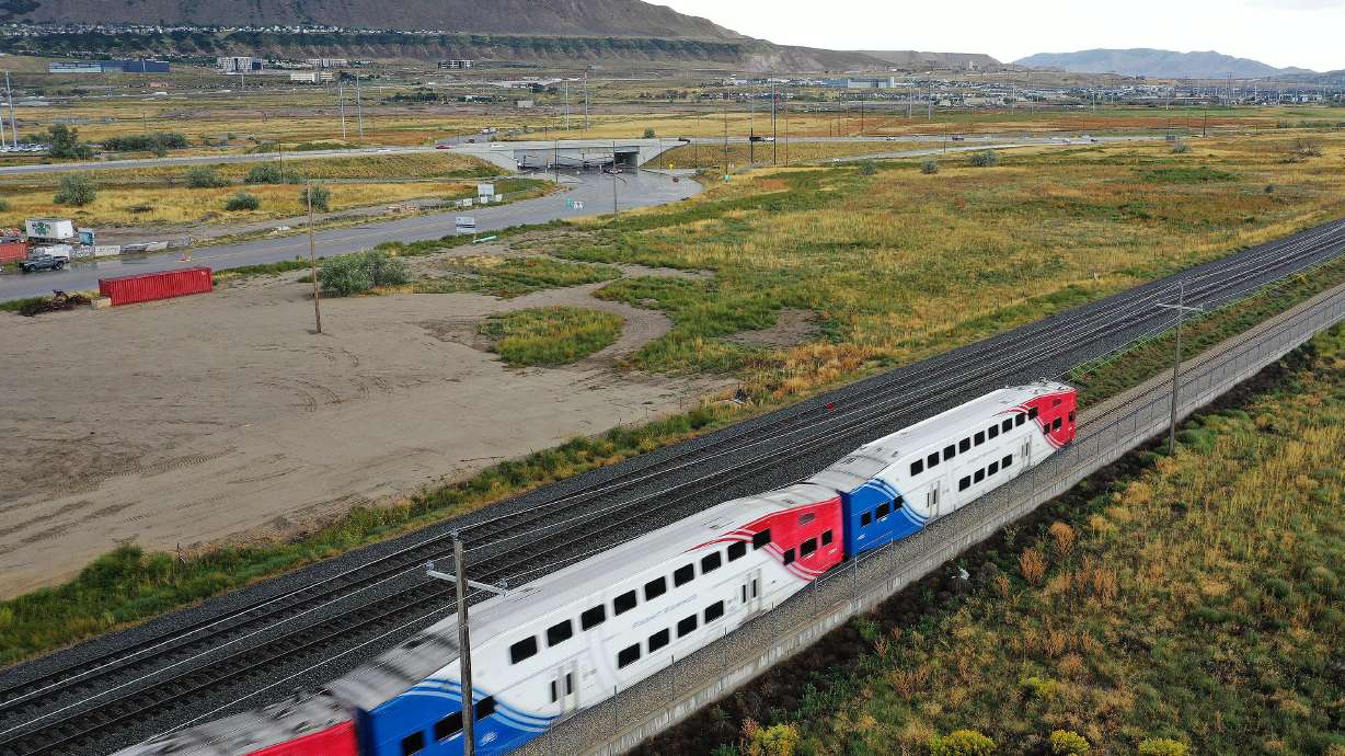 A Utah Transit Authority FrontRunner travels near Point of the Mountain in Bluffdale on Sept. 19, 2...
