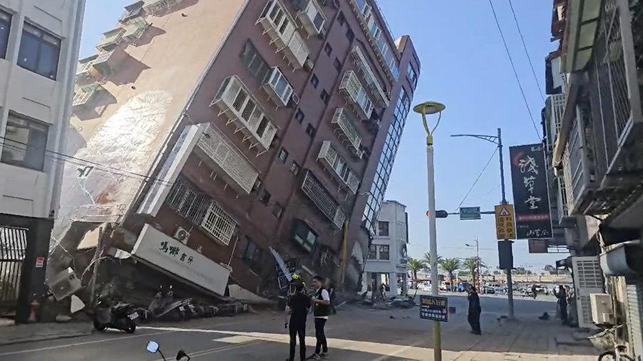 In this image taken from a video footage run by TVBS, a partially collapsed building is seen in Hua...