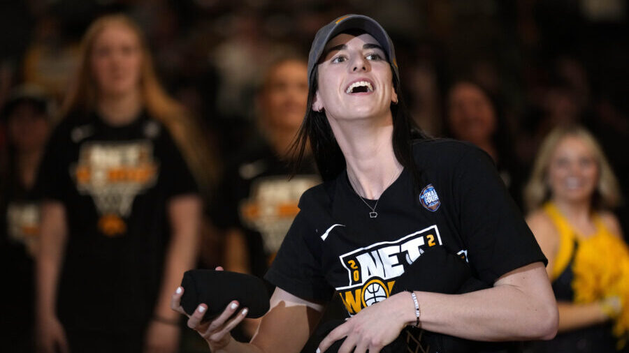 Iowa guard Caitlin Clark reacts to fans during an Iowa women's basketball team celebration, Wednesd...