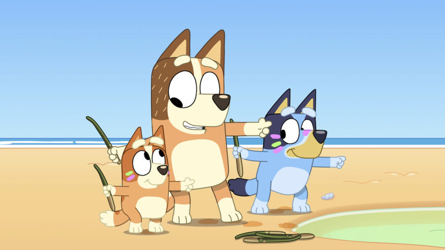 Bluey and two other cartoon dogs point...