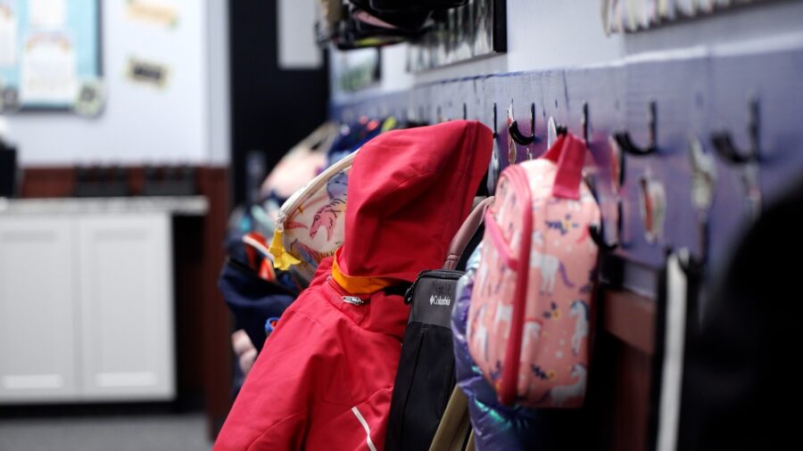 FILE - Backpacks and coats line the wall (KSL TV)...