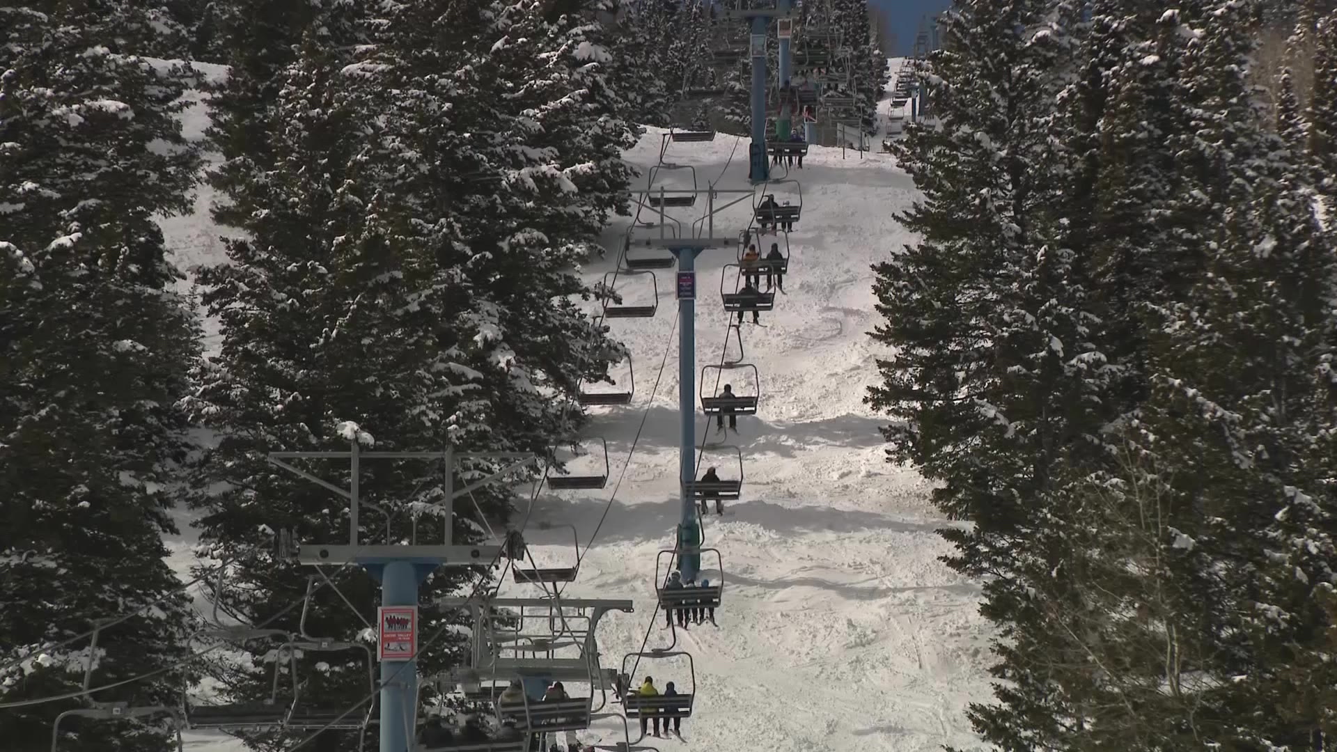 Skiers on chair lifts at the Beaver Mountain Resort....