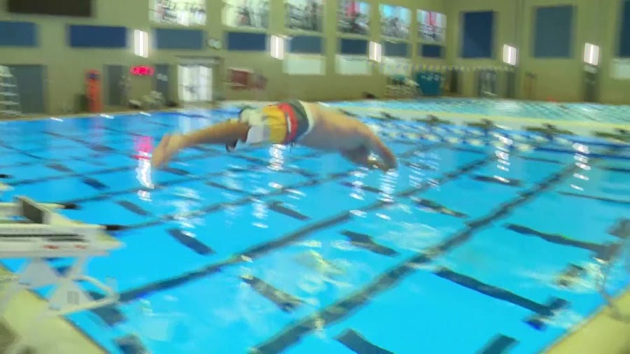 Casey Scott dives into the pool at the South Davis Aquatic Center in Bountiful. (KSL TV)...