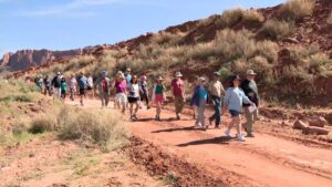 A group of hikers on a trail in the Dry Wash area.