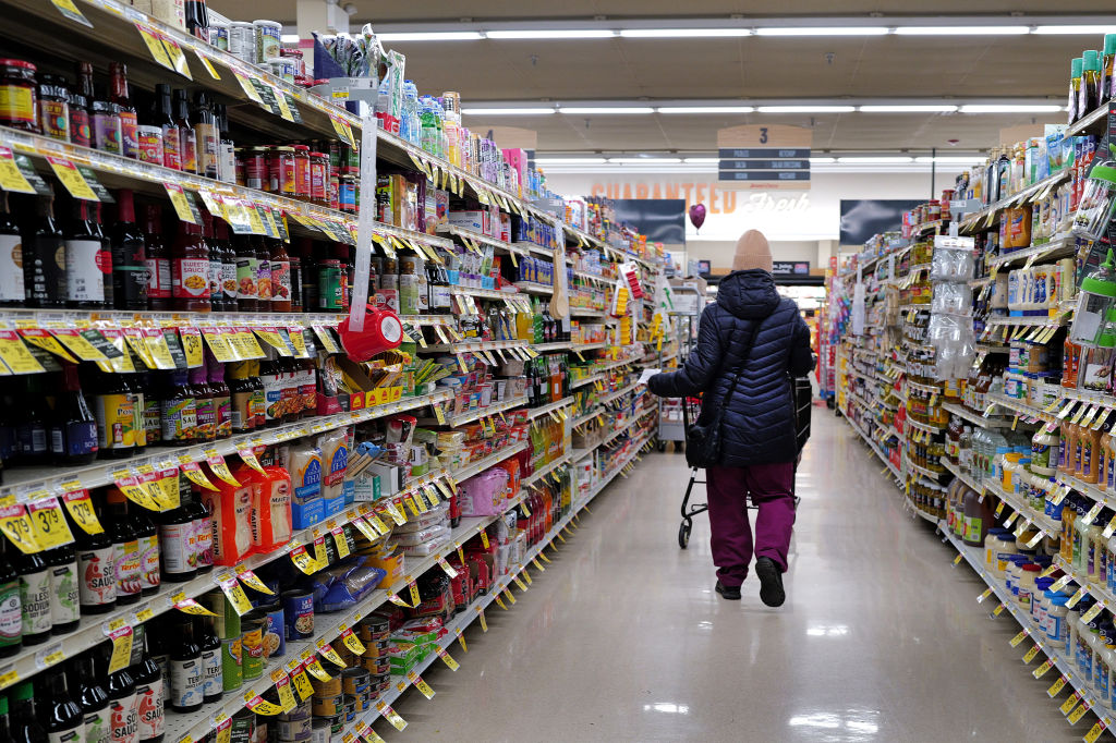 FILE: A customer shops at a grocery store on February 13, 2024 in Chicago, Illinois. Grocery prices...