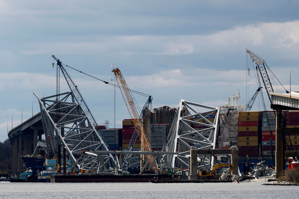 BALTIMORE, MARYLAND - APRIL 05: Cranes and salvage personnel surround the collapsed Francis Scott K...