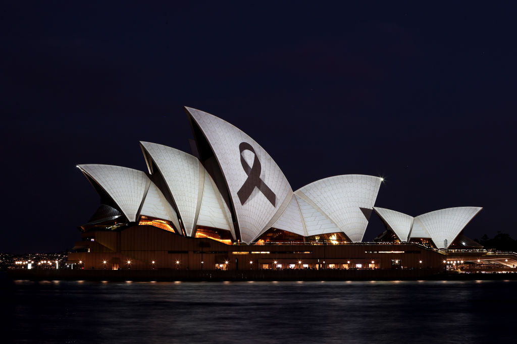 SYDNEY, AUSTRALIA - APRIL 15: The Sydney Opera House is illuminated with a black ribbon in honour o...