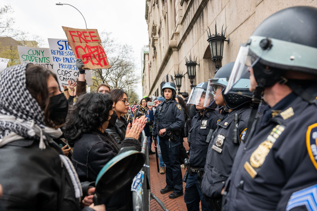 NEW YORK, NEW YORK - APRIL 18: Students and pro-Palestinian activists face police as they gather ou...