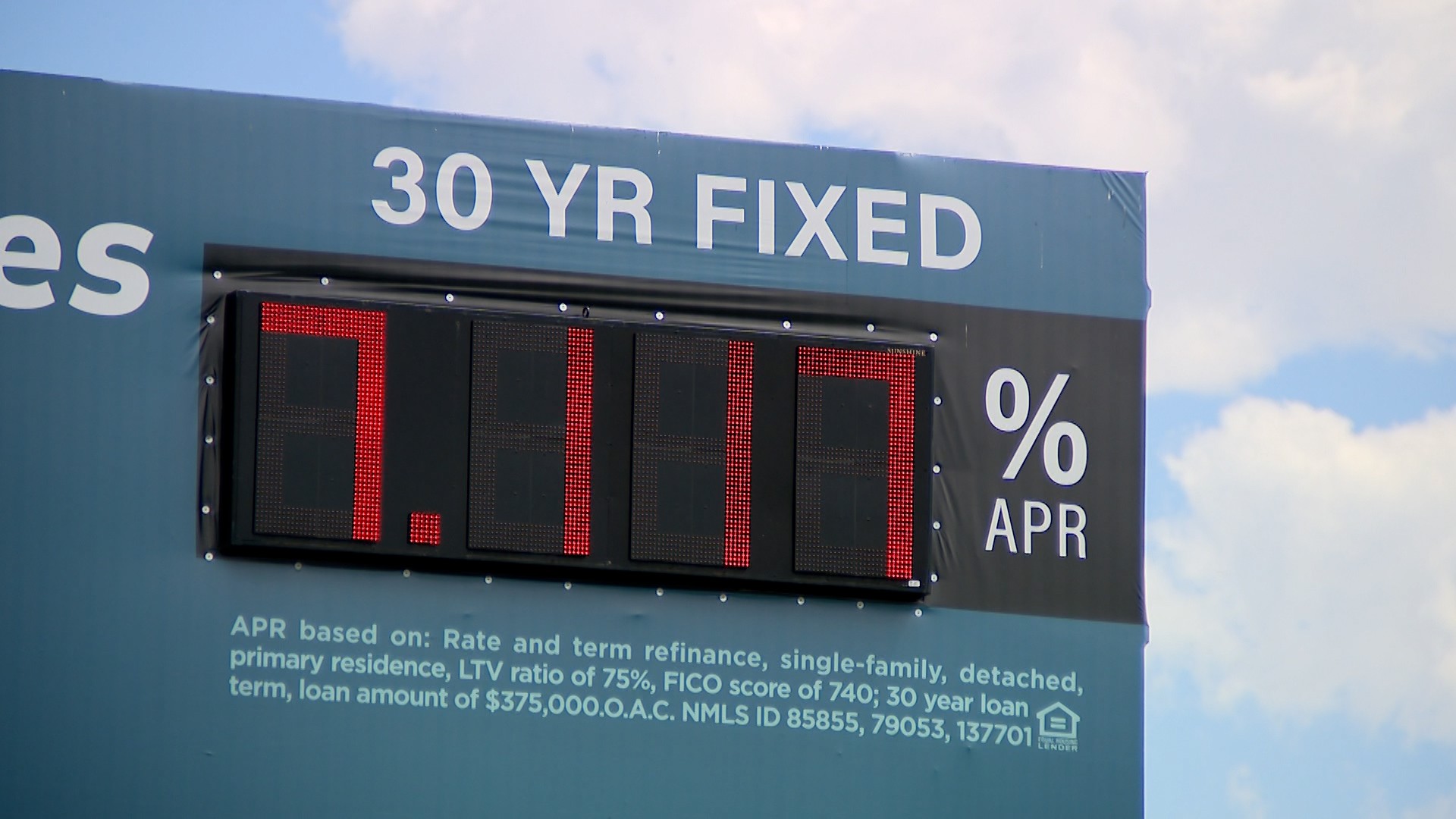 A billboard advertising mortgage rates for buying a house in April 2024....