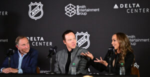 Ashley Smith, co-founder of Smith Entertainment Group, speaks as she joins her husband, Ryan Smith, co-founder and chairman of Smith Entertainment Group, and NHL Commissioner Gary Bettman at a press conference at the Delta Center in Salt Lake City to announce that the NHL would be coming to Utah on Friday, April 18, 2024. 