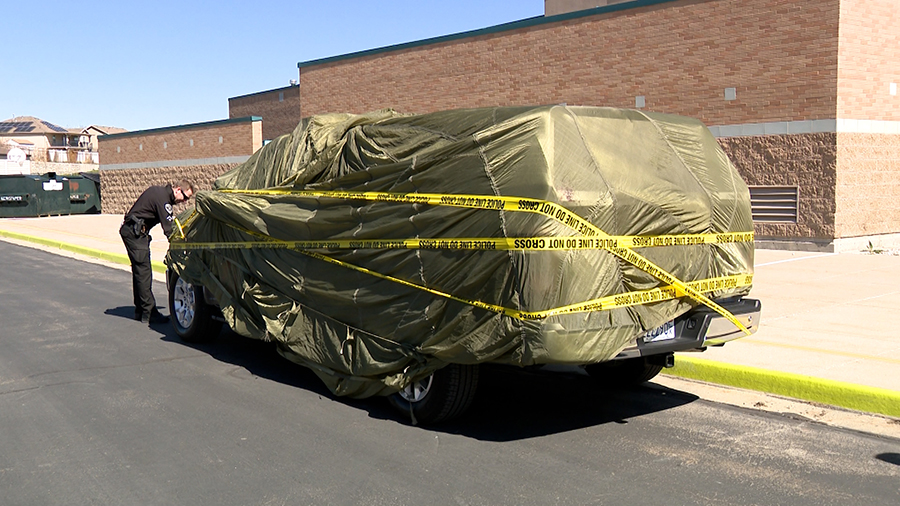 Police car wrapped in paper and crime tape...
