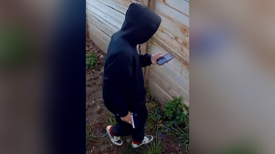 Surveillance footage of a teen trespassing on a Kaysville's property while playing the "Senior Assa...