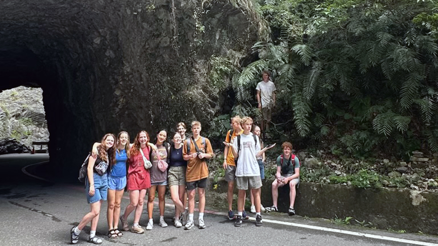 Utah students standing on a road in a gorge...