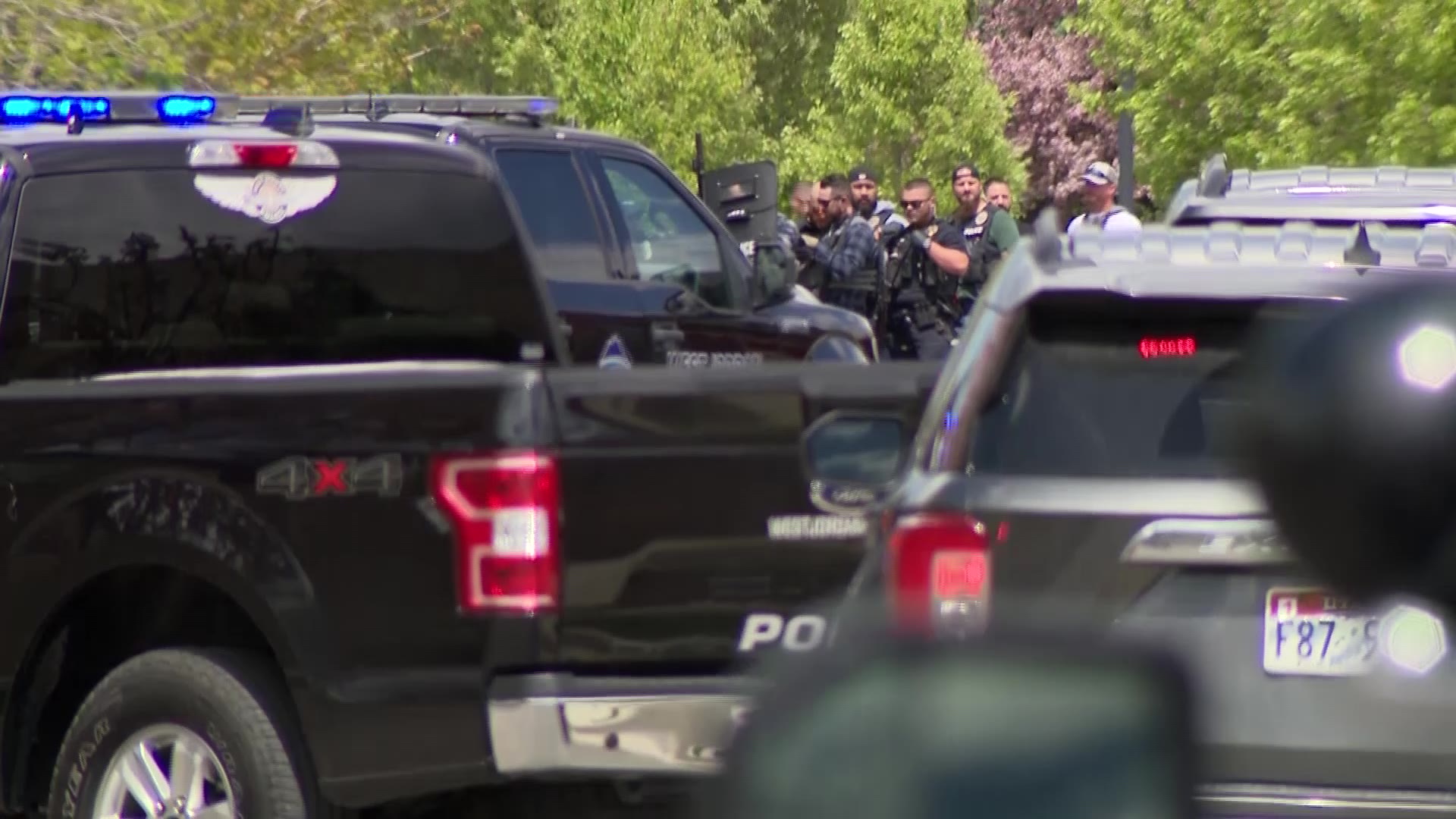 Armed first responders outside of a West Jordan home after fake calls of an active shooter...