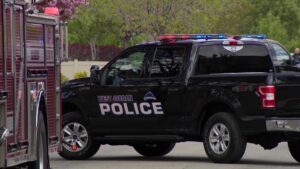 A West Jordan police car blocking the road leading to the home. 