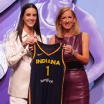 Caitlin Clark poses with WNBA commissioner Cathy Engelbert after she is selected with the No. 1 overall pick to the Indiana Fever. (Brad Penner, USA Today) 
