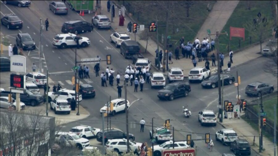 Police are seen at the scene of a shooting on April 10, in Philadelphia....