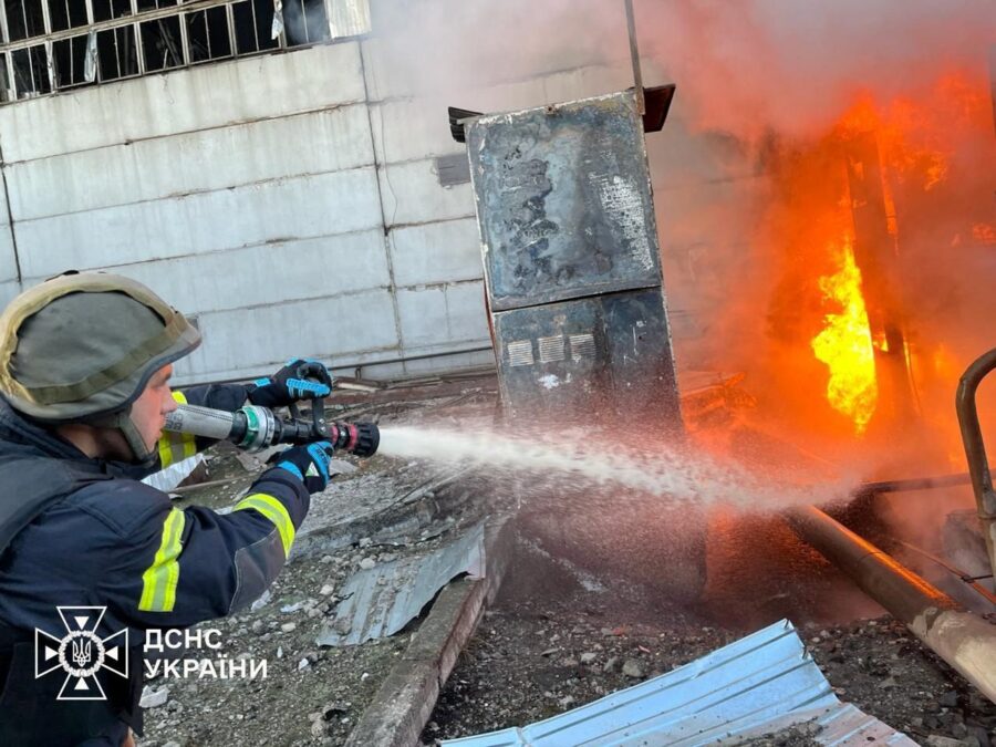 A firefighter tackles a blaze after a Russian attack on a power station at an undisclosed location ...