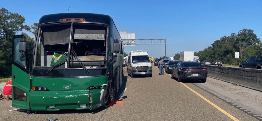 Law enforcement officials direct traffic following an incident involving a charter bus on I-10 west...