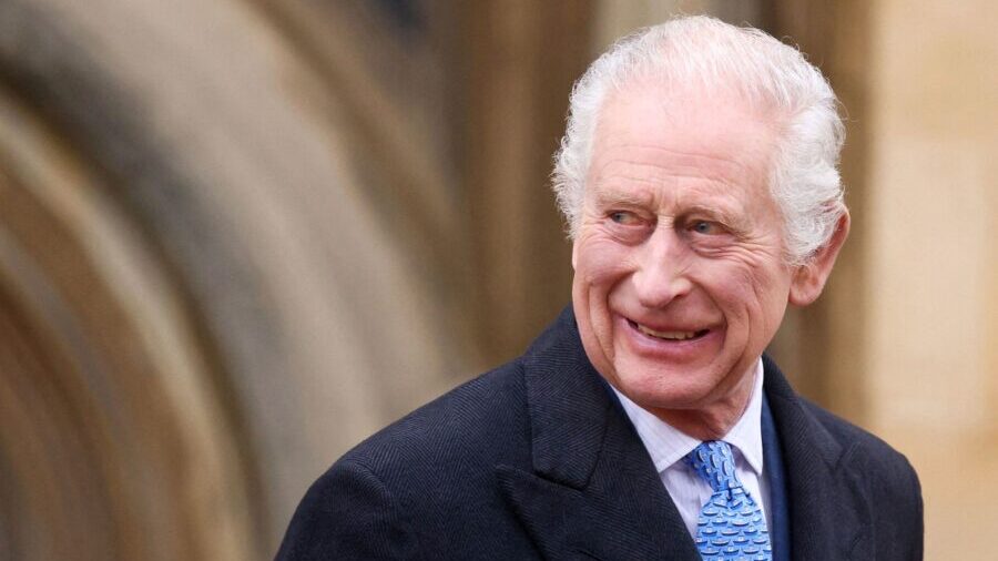 King Charles III smiles as he leaves St. George's Chapel in Windsor on Easter  morning. (Getty Imag...